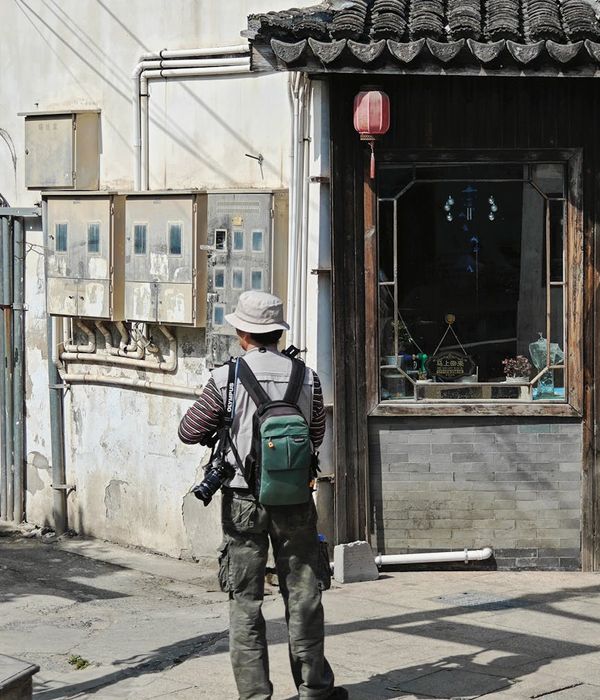 Backpacker standing at crossroads ready to explore Asian destinations