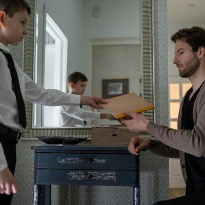 Enthusiastic young man documenting travel experiences with notebook