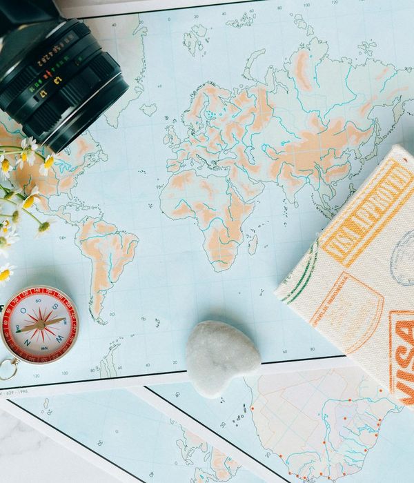 Passport with multiple visa stamps and travel documents