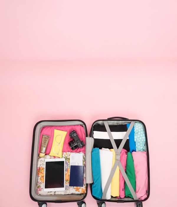 Well-organized backpack with travel essentials laid out neatly